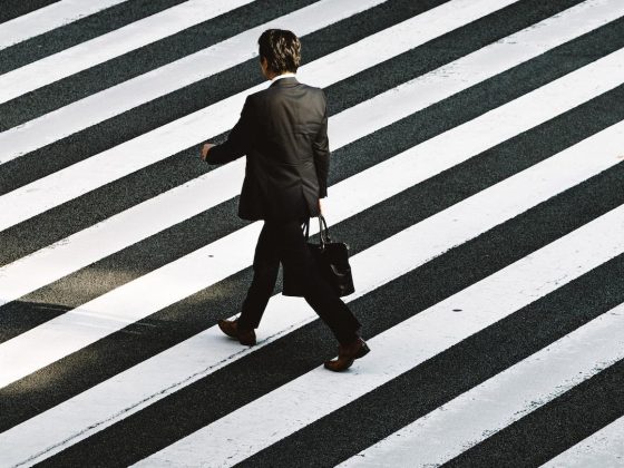 Man walking on pedestrian by Ryoji Iwata